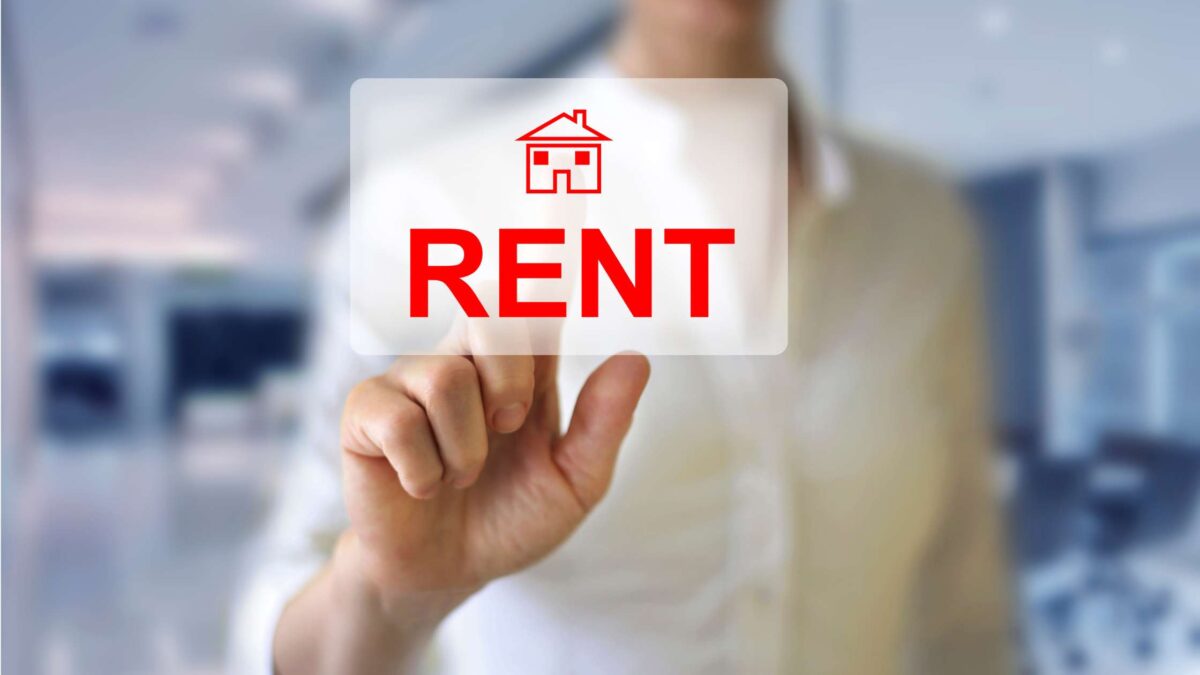 Person holding a rental sign with the word "RENT," representing Australia's rental housing market, build-to-rent developments, tenant demand, and property investment opportunities