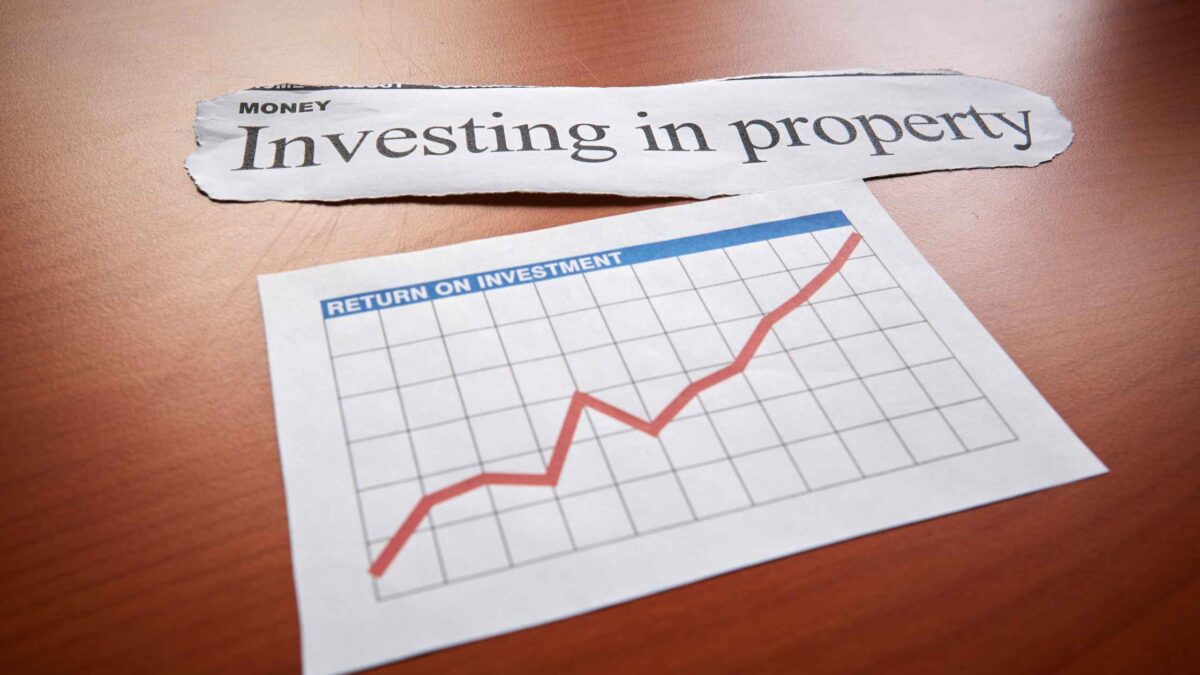craete an alt text for this Newspaper clipping reading “Investing in property” above a return-on-investment chart showing an upward trend.